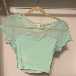 Crop top that is see through in the back.